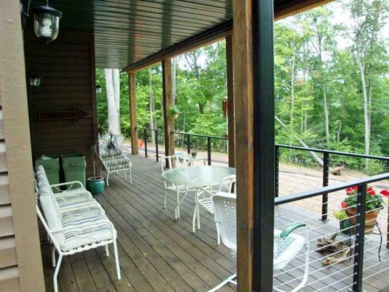 custom deck and doors looking out to the woods