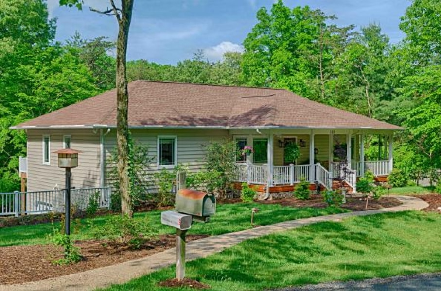 nice house with open shaded porch and see-through windows