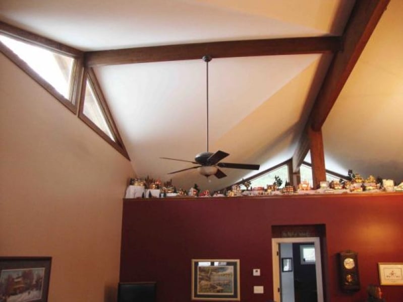 great room with exposed beams and lots of great wood